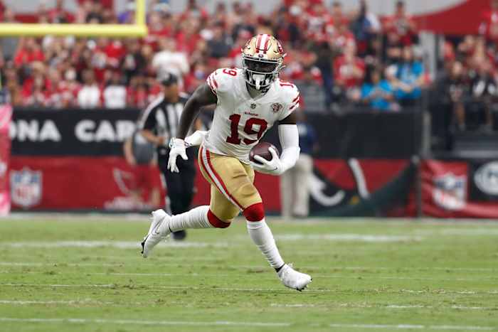San Francisco 49ers WR Deebo Samuel runs with football
